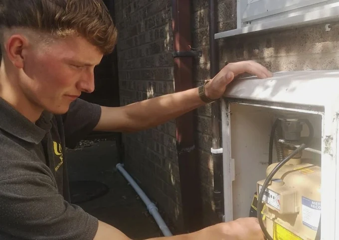 Hewitt Heating engineer working on a gas meter