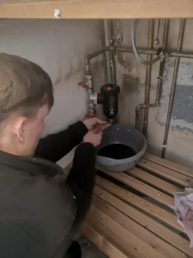 Hewitt Heating engineer working on pipework